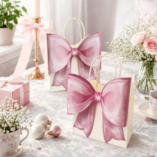 Set of pink gift bags with oversized satin bows and loop handles