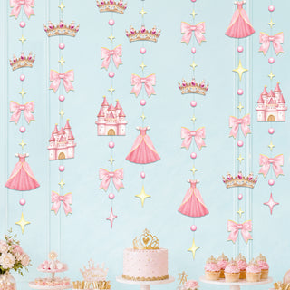 Pink princess garland decorations: crowns, castle houses, star charms, and ribbon bows