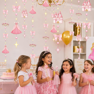Princess garland backdrop with crowns, castles, stars, and pink bows behind children