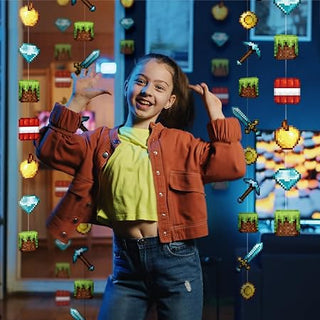 Gaming themed pixel wall banner decorations with a smiling child posing on a decorated wall