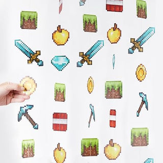 Gaming pixel wall banner set pieces spread out, with a hand holding a gold coin