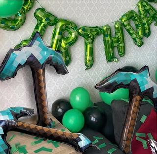 Pickaxe-shaped foil balloon centerpiece, teal and black check panels with brown stripe