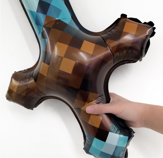 Close-up of long sword foil balloon with teal and brown checker argyle pattern