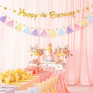 Happy Birthday banner with gold letters, crown motif, and pastel tulle dress pennants