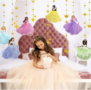 Princess dress garland set hanging behind a child, with pink, blue, purple and green skirts