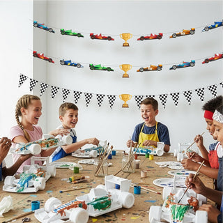 Party banner string with checkered flags, trophy icons, and race car graphics