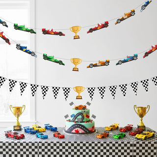 Race car party banner with checkered pennants, trophy icons, and race car motifs