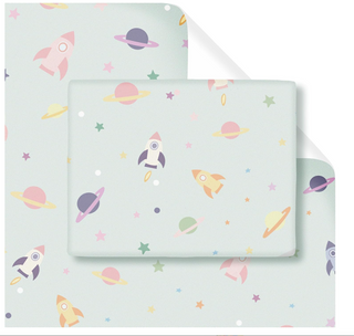 Stack of rocket-pattern gift wrapping paper sheets, pastel planets and stars