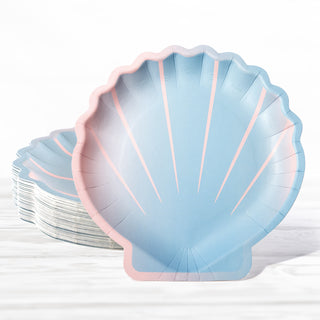 Shell-shaped paper party plates in blue and pink, scalloped edge, stacked
