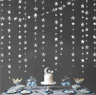 Silver star garlands kit with hanging silver star strands forming a wall design