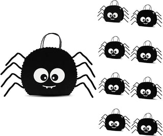 Black spider-shaped gift bag with smiling cartoon face, loop handle and fabric legs
