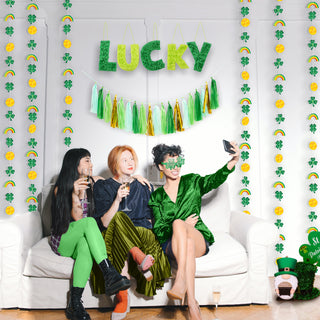 St Patrick’s Day backdrop set with 'LUCKY' sign and multicolor tassel garland
