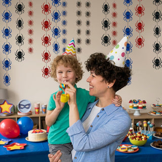 Spider garland decorations covering the wall with colorful red, blue, and black spiders