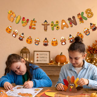 Thanksgiving banner garland spelling “GIVE THANKS” with fall animal and pumpkin charms