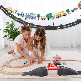 Curved transport banner with buses, trucks, cars, and trees hanging on a wall