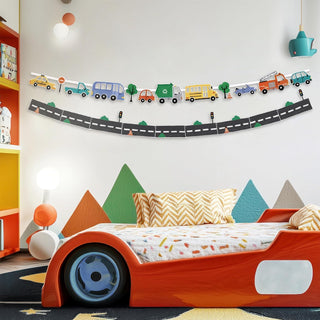 Curved transport road banner with vehicles and trees above a child bed