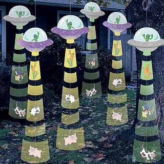 UFO alien hanging garland with gray UFO caps, green alien faces, and dangling paper strips