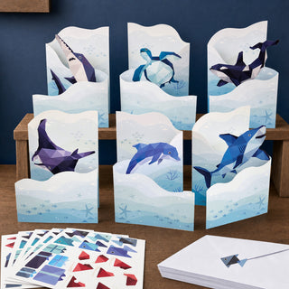 Multiple undersea greeting cards with envelopes and sea animal designs, sticker sheet included