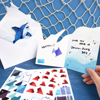 Undersea greeting card with envelope and blue fish stickers, handwritten message