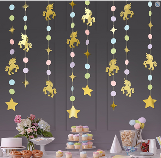 Hanging unicorn garland strands with gold unicorns, star cutouts, and pastel bead circles