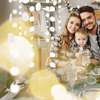 White hanging garland strands with oval drops, overhead decoration.