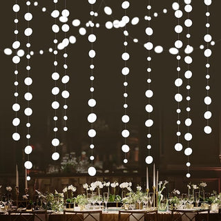 White hanging garland strands with oval drops, multiple vertical rows.