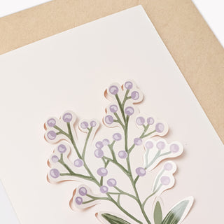 Purple wildflower sticker on greeting card, raised botanical stems and blossoms