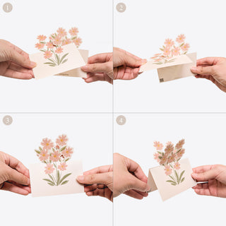Set of floral table note cards held by hands, pastel wildflower bouquet illustrations