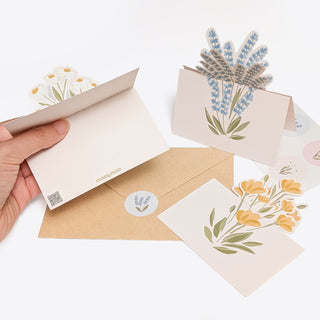 Wildflower table note cards with pastel flower die-cuts and kraft envelopes