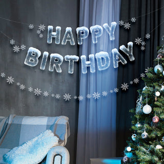 HAPPY BIRTHDAY banner with icy blue balloon-style letters and white snowflake cutouts