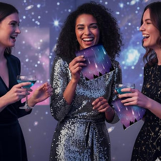 Guests using galaxy-themed paper napkins at a space birthday party table setup 2 