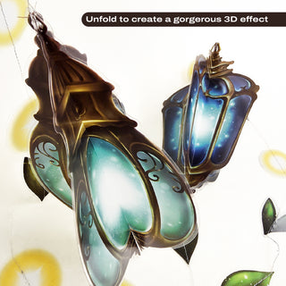Hanging blue glass-look lanterns with ornate metal caps on a leaf garland