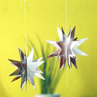 Metallic silver hanging 3D star garland ornaments on thin strings