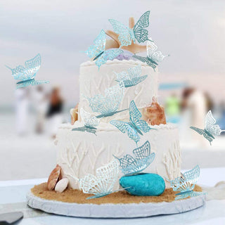 Teal blue 3D butterfly stickers for birthday decorations on a cake stand