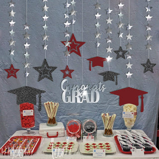 Graduation cap and star banner garland with silver stars, dark glitter mortarboards, burgundy caps