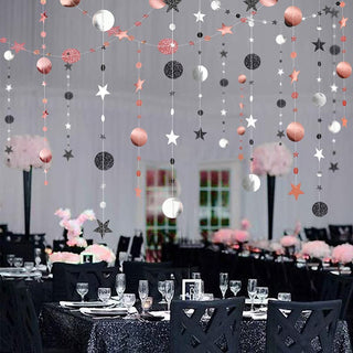 Rose gold and black glitter star and circle dot hanging garland on vertical strands