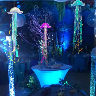 Pair of glitter jellyfish decorations, purple and teal iridescent caps with hanging streamers