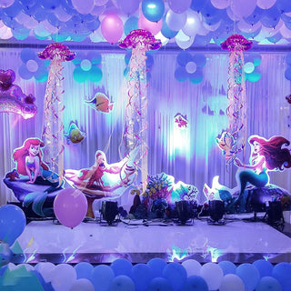 Hanging iridescent purple jellyfish decorations with long ribbon streamers and bell tops
