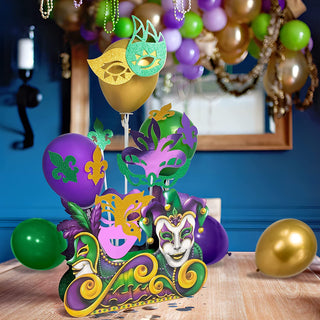 Mardi Gras mask centerpiece set with gold, purple and green figures on stick stems