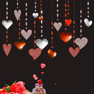 Glitter heart garland with pink, red, and silver heart charms and bead strands