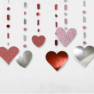 Glitter heart decorations with pink, red, and silver hearts and hanging bead strings