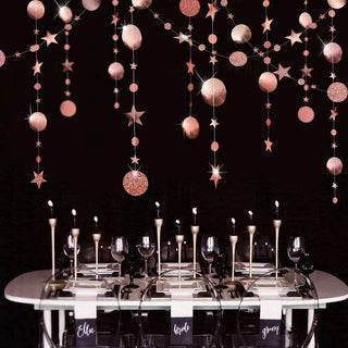Rose gold hanging party garland with glitter circles, dots, and star accents