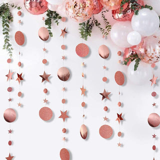 Rose gold hanging party garland with glitter circles, stars, and oval ornaments