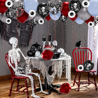 Halloween balloon decoration with skull-printed balloons and red, silver, and light blue balloons