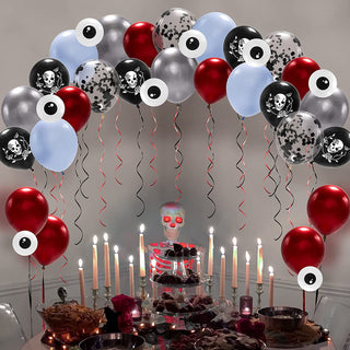 Halloween balloon cluster in red, silver, black, and light blue with skull and confetti patterns