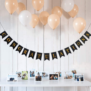Shimmer congratulations banner on black triangular pennants with gold letters