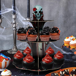 Skull 3-tier cupcake stand with red rose topper, holding decorated cupcakes