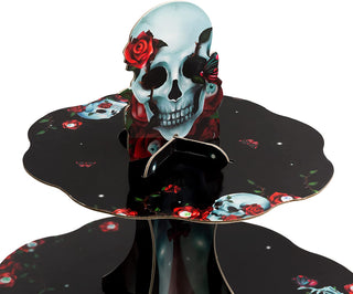 Skull cupcake stand top with red rose, three circular tiers with colorful details