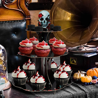 3-tier cupcake stand with skull topper and red rose, filled with cupcakes